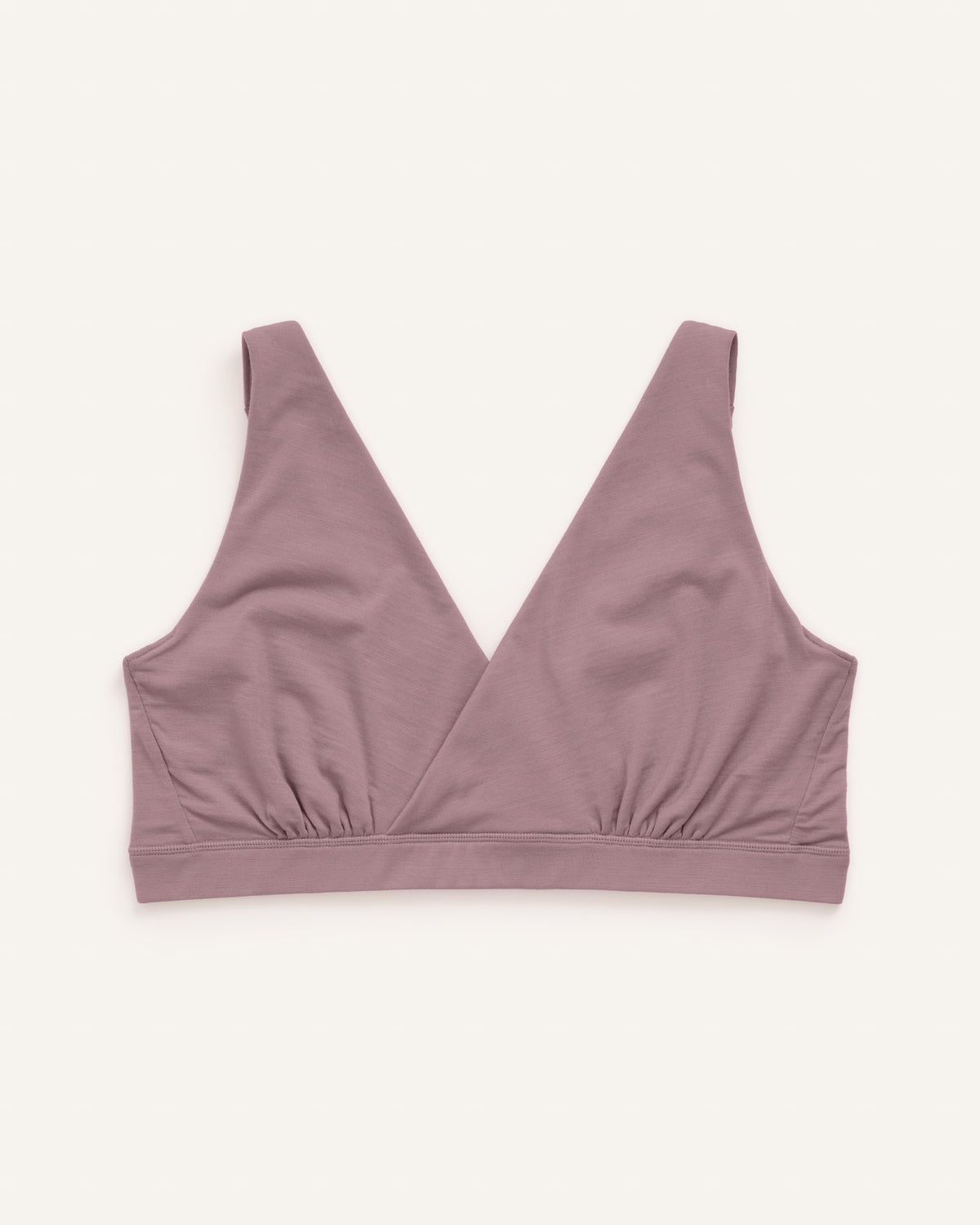 Laydown of Roam Wrap Bra in Lavender, a dusky muted purple color. Roam Wrap Bra is a merino wool underwear item available in sizes 1X-3X.