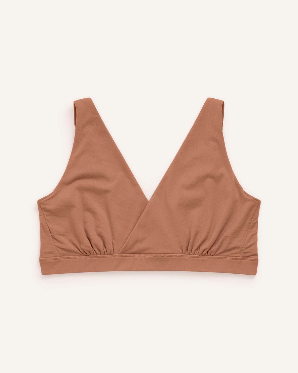 Laydown of Roam Wrap Bra in Mocha Brown, a medium-dark nude color. Roam Wrap Bra is a merino wool underwear available in sizes 1X-3X.