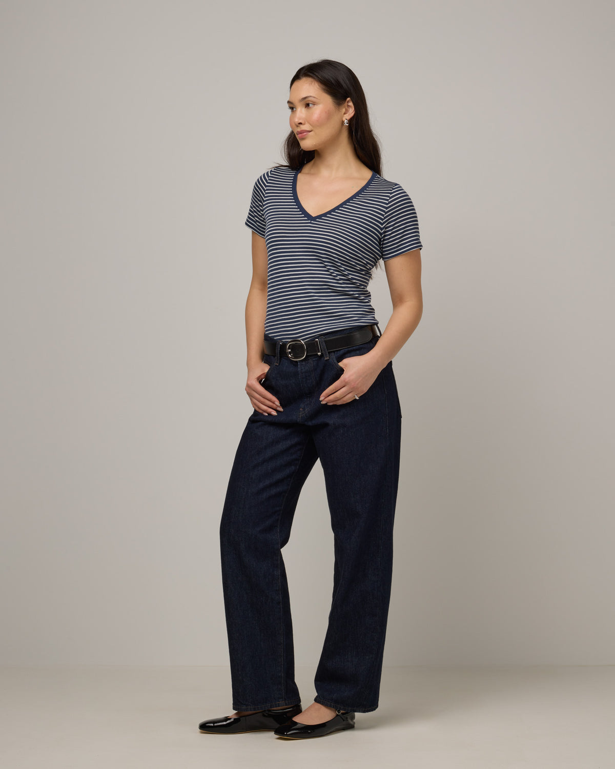 Model wearing Morgan V-Neck Tee in Marine Blue & Natural White Stripe. Morgan V-Neck Tee is a merino wool short sleeve, v-neck, regular fit tee available in sizes XS-3X.