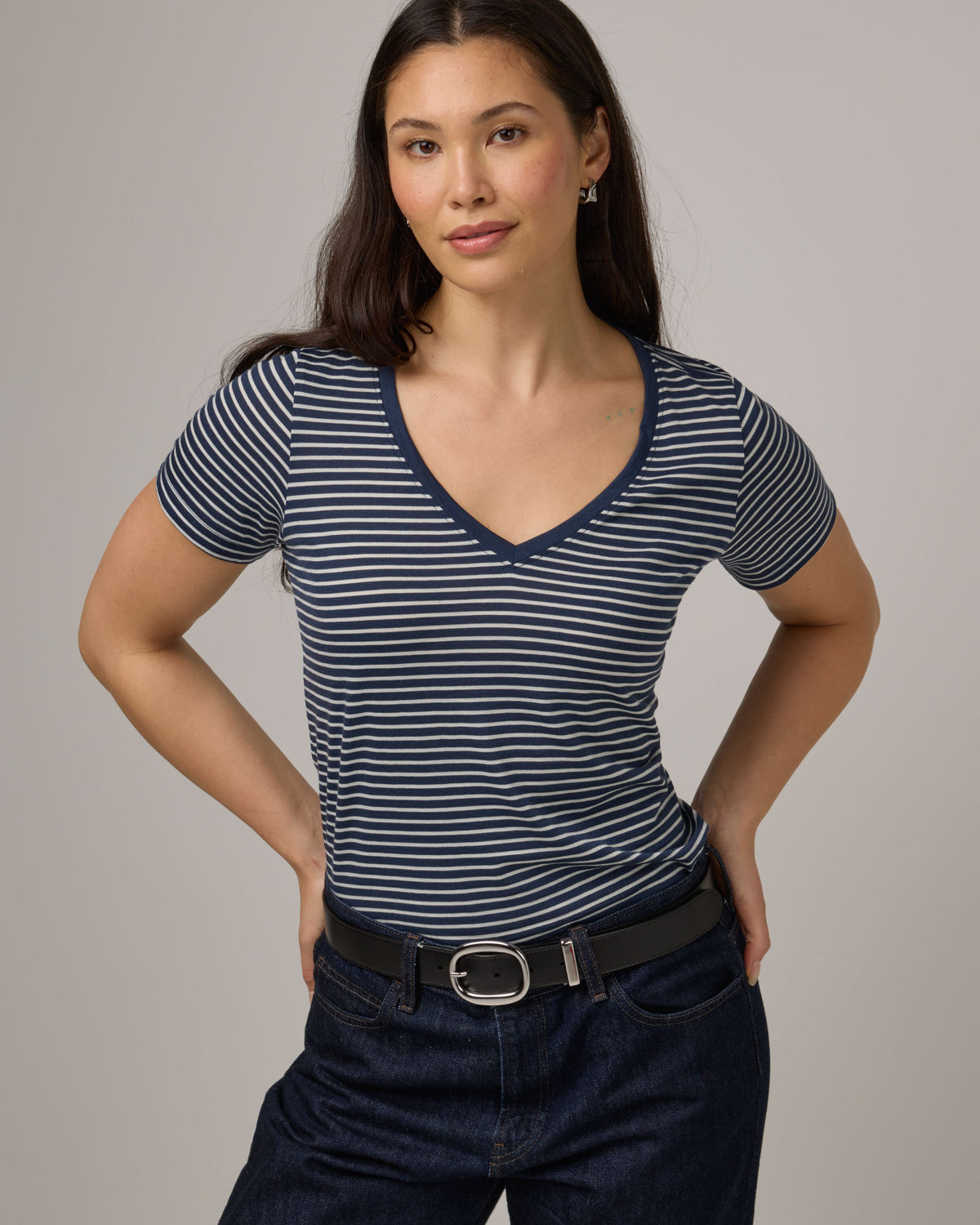 Model wearing Morgan V-Neck Tee in Marine Blue & Natural White Stripe. Morgan V-Neck Tee is a merino wool short sleeve, v-neck, regular fit tee available in sizes XS-3X.