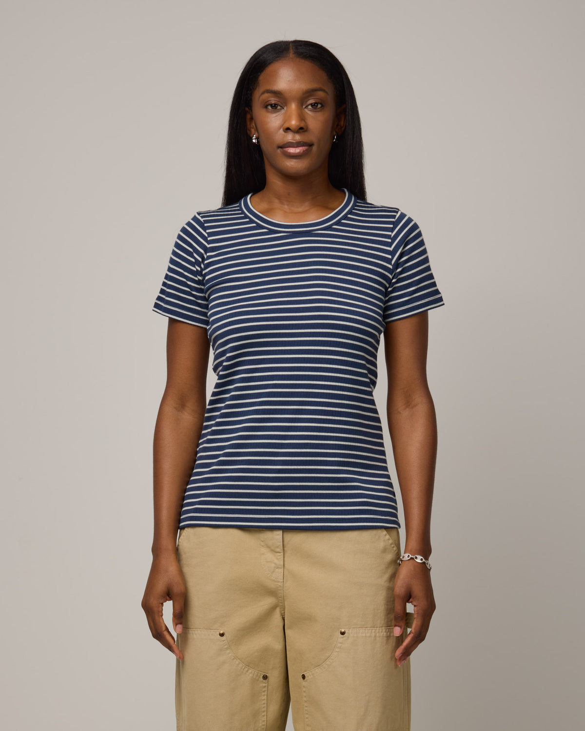 Model wearing Taylor Ribbed Tee in Marine Blue & Natural White Stripe. Taylor Ribbed Tee is a merino wool short sleeve, crew neck tee available in sizes XS-3X.