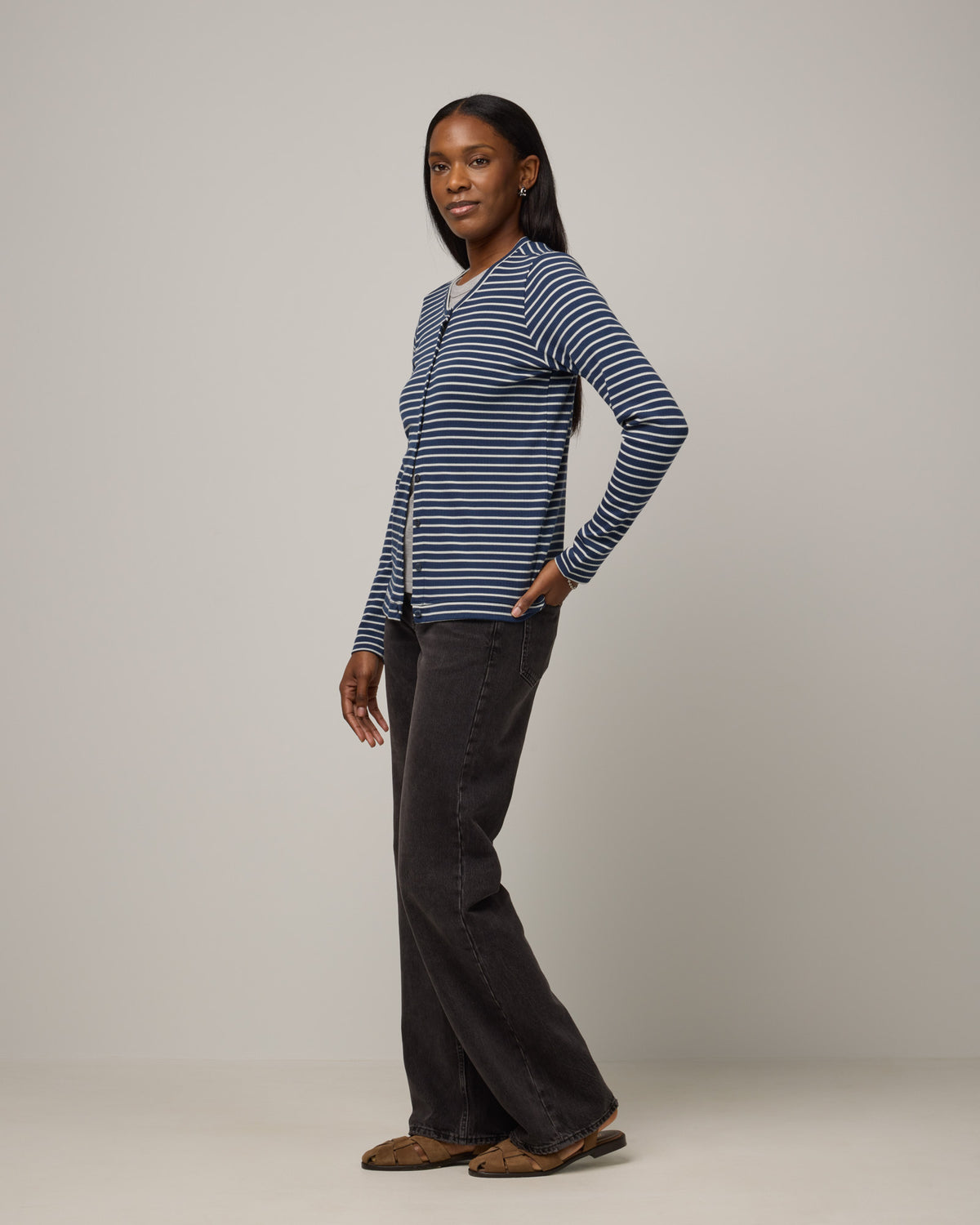 Model wearing Celeste Ribbed Cardigan in Marine Blue & Natural White Stripe. Celeste Ribbed Cardigan is a merino wool long sleeve, crew neck cardigan available in sizes XS-3X.
