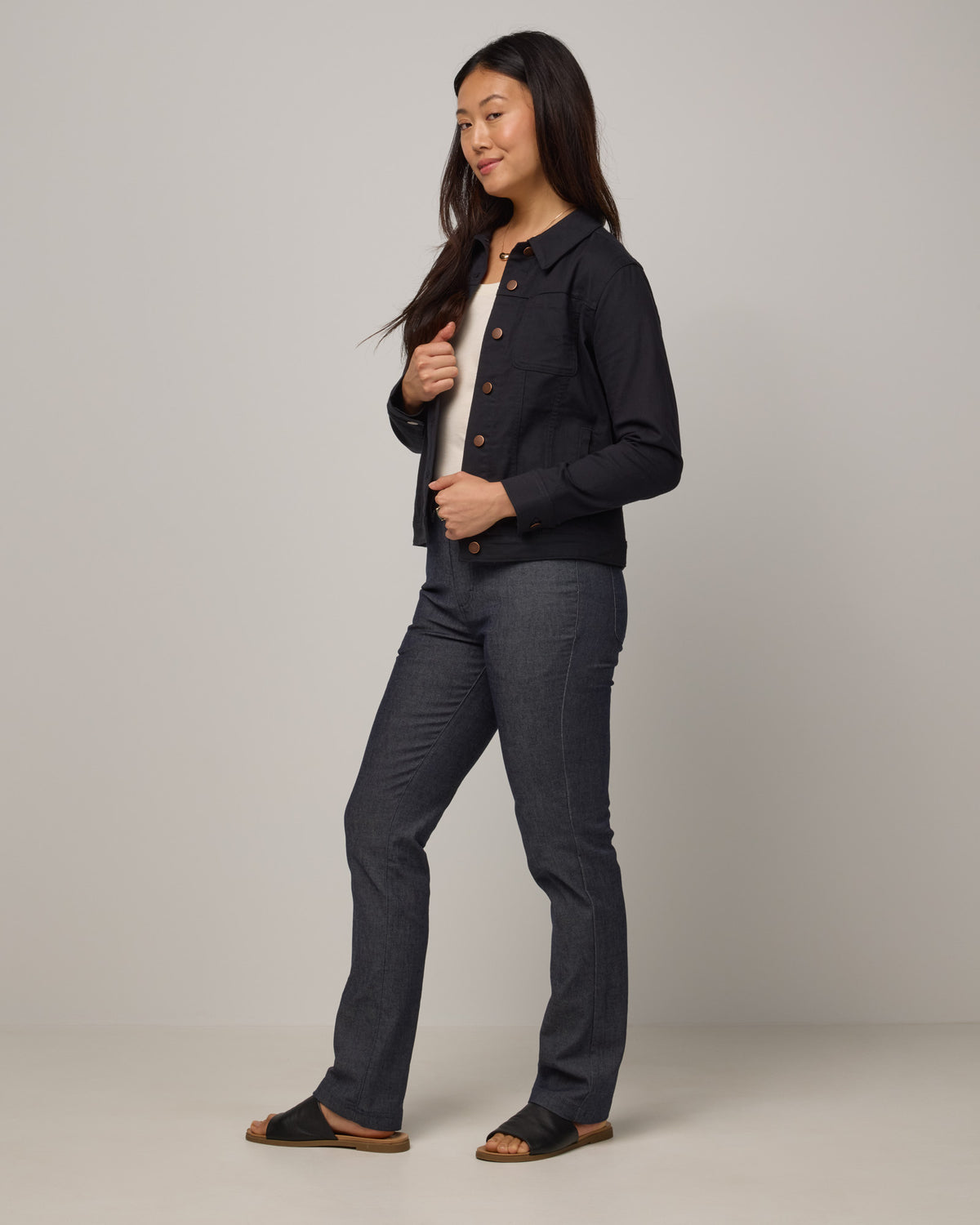 Model wearing Logan Denim Jacket in Black. Logan Denim Jacket is a merino wool classic long sleeve, collared denim jacket available in sizes XS-XXL.
